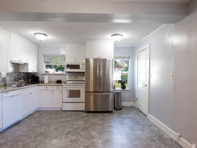 155 West Center Street Fillmore, UT 84631 - Photo 24 of 86 Kitchen featuring white cabinetry, stainless steel refrigerator, white range, and built-in microwave
