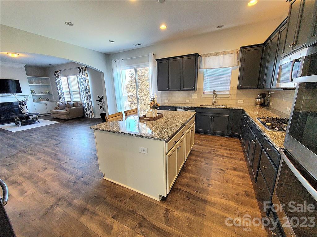 10013 Sunset Ridge Midland, NC 28107 - Photo 13 of 45 a kitchen with sink a counter top space and cabinets