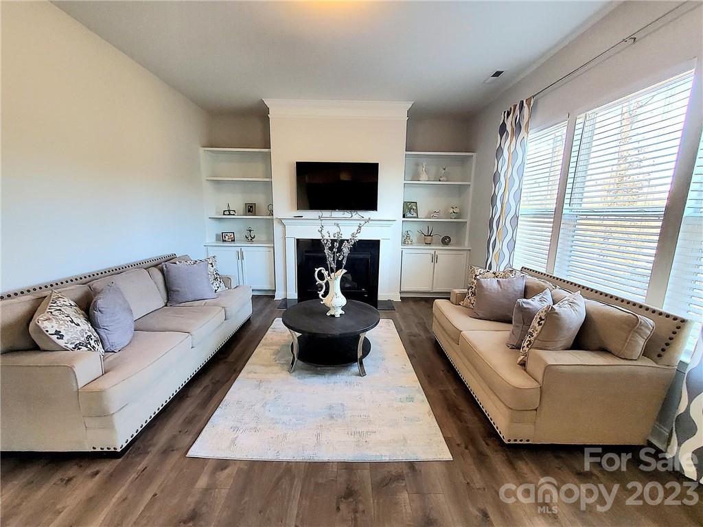 10013 Sunset Ridge Midland, NC 28107 - Photo 14 of 45 a living room with furniture and a flat screen tv