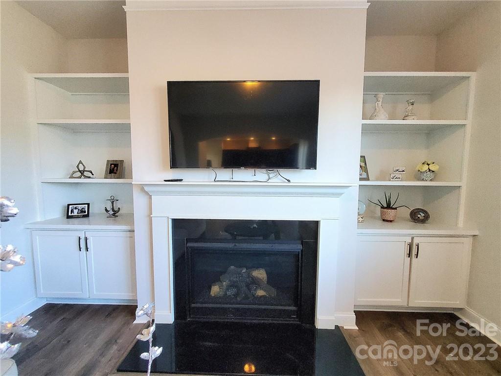 10013 Sunset Ridge Midland, NC 28107 - Photo 16 of 45 a living room with a fireplace and a flat screen tv