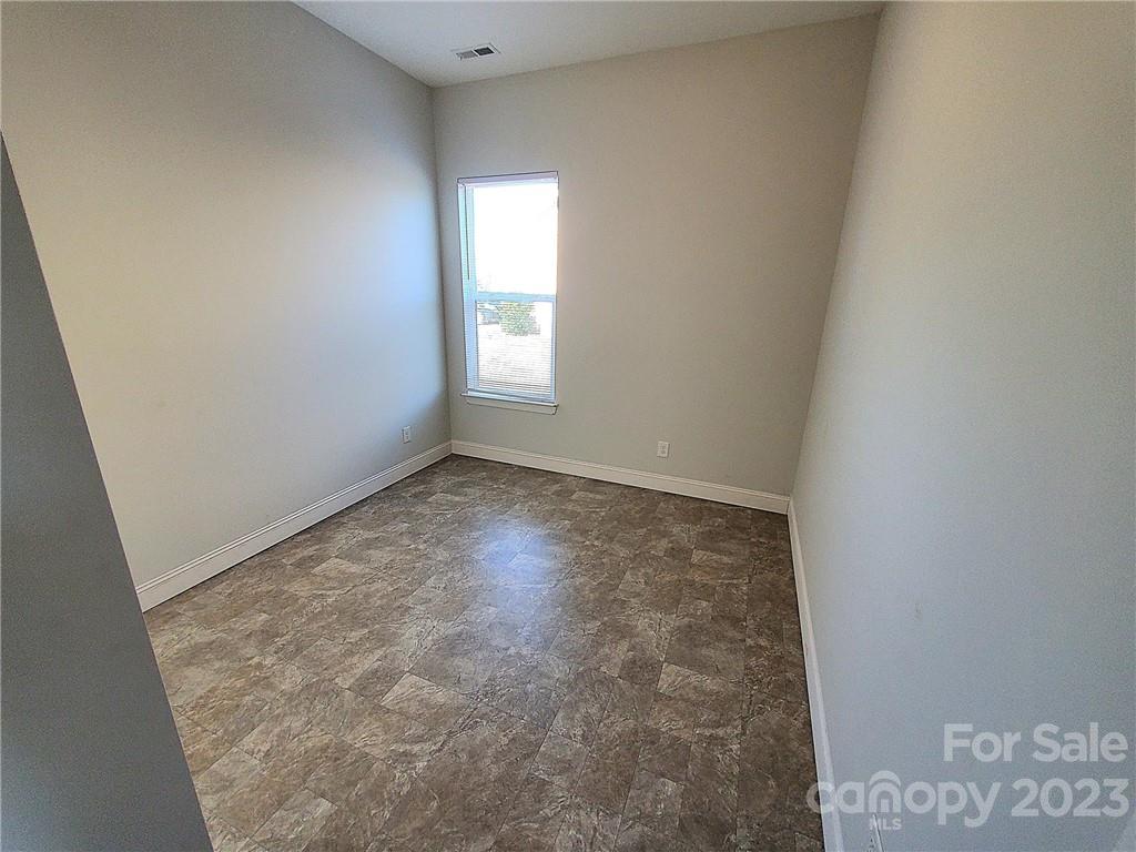 10013 Sunset Ridge Midland, NC 28107 - Photo 19 of 45 an empty room with windows