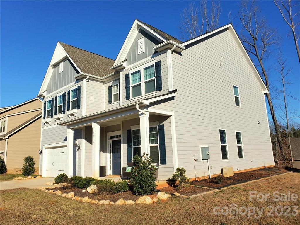 10013 Sunset Ridge Midland, NC 28107 - Photo 2 of 45 a front view of a house with a yard