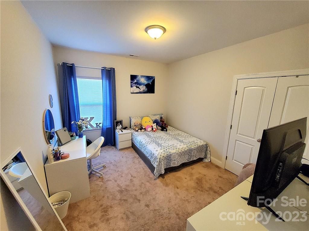 10013 Sunset Ridge Midland, NC 28107 - Photo 27 of 45 a living room with furniture and a flat screen tv