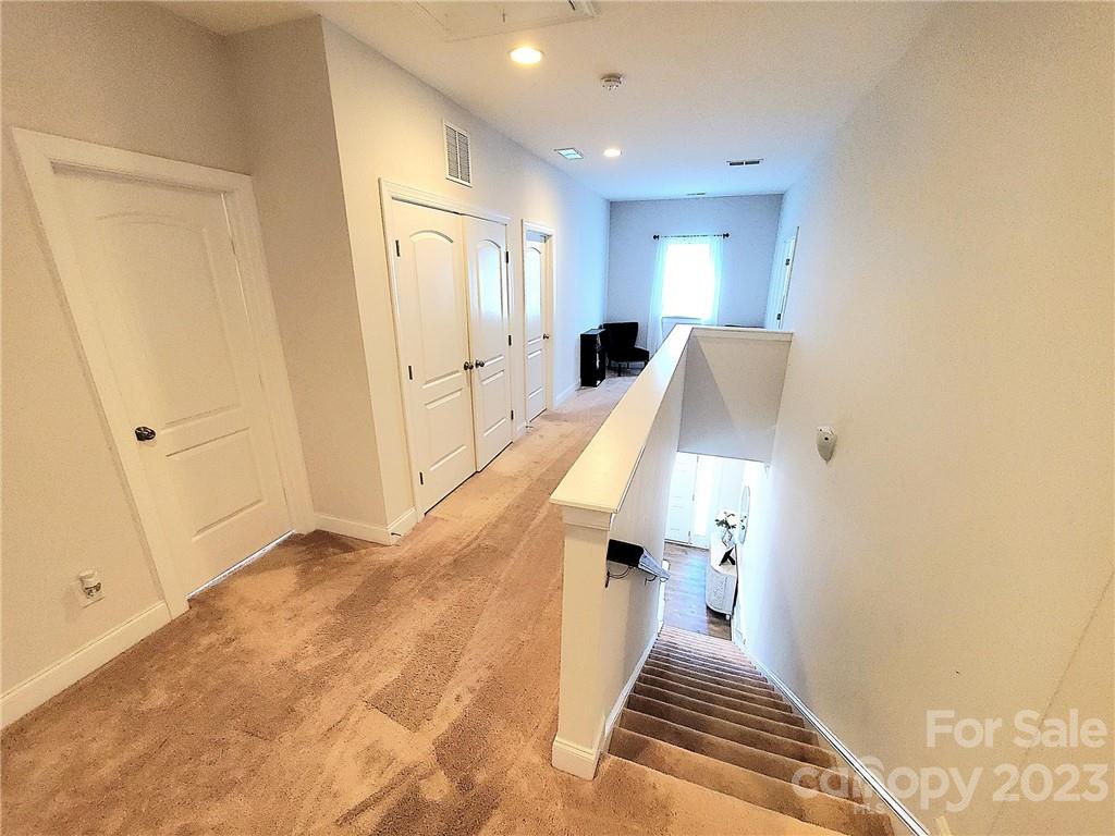 10013 Sunset Ridge Midland, NC 28107 - Photo 28 of 45 a view of a hallway with windows