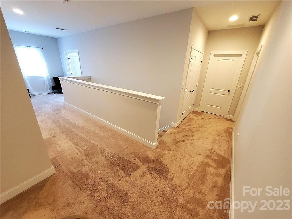 10013 Sunset Ridge Midland, NC 28107 - Photo 29 of 45 a view of a big room with wooden floor and a bathroom