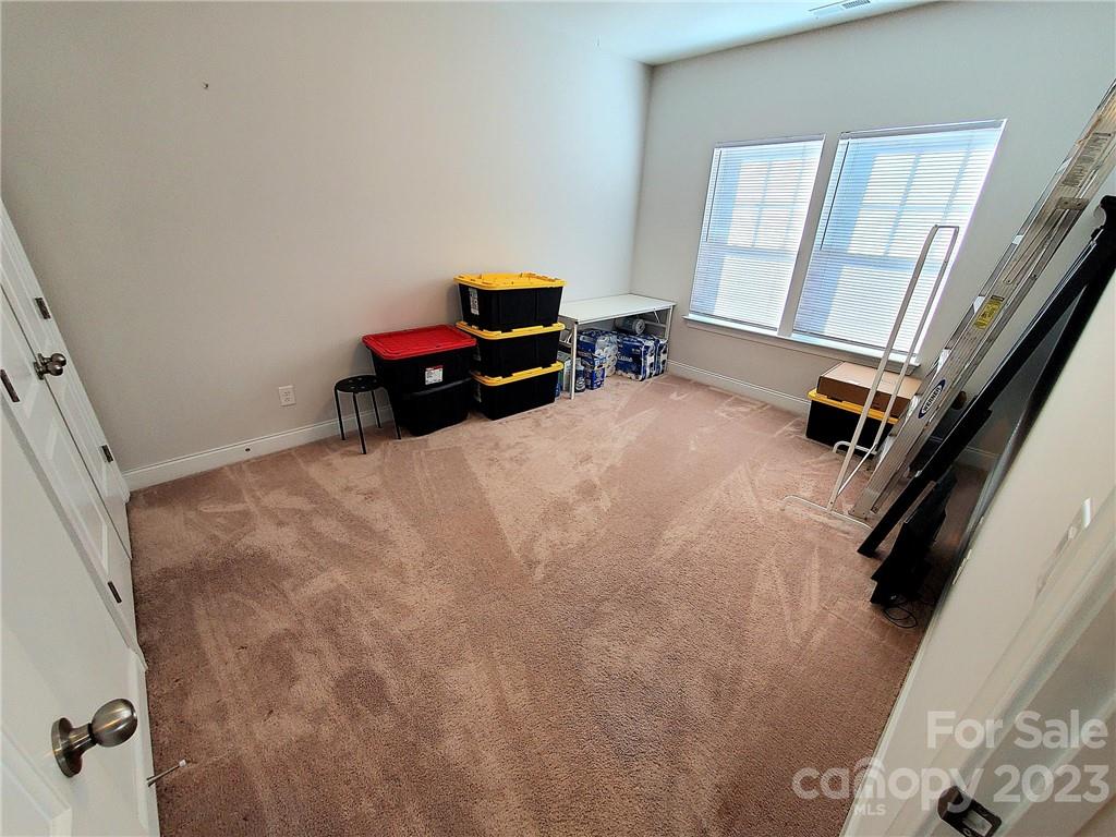 10013 Sunset Ridge Midland, NC 28107 - Photo 35 of 45 a bedroom with a bed and a window