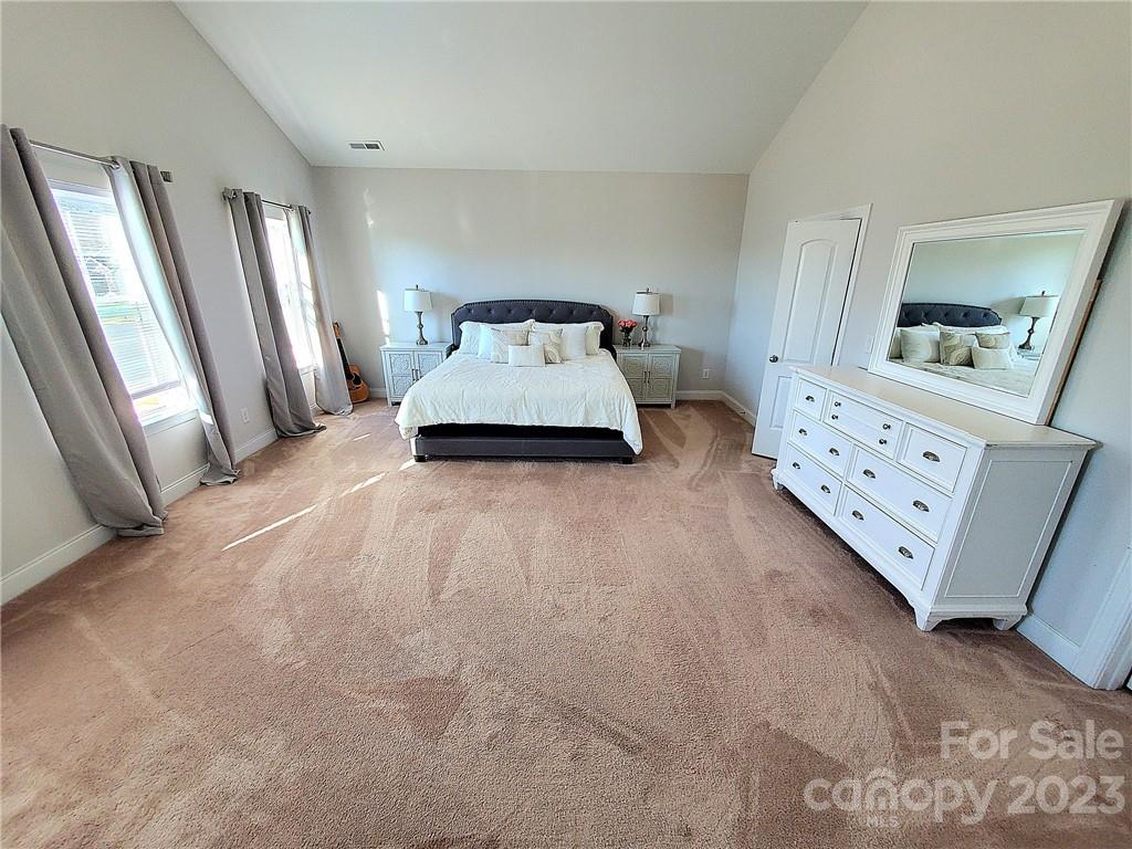 10013 Sunset Ridge Midland, NC 28107 - Photo 36 of 45 a spacious bedroom with a bed and window