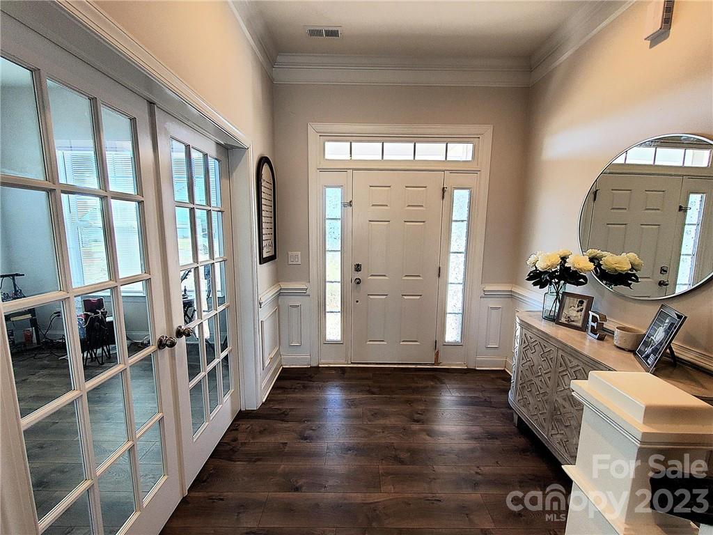 10013 Sunset Ridge Midland, NC 28107 - Photo 5 of 45 a view of a hallway with wooden floor and windows