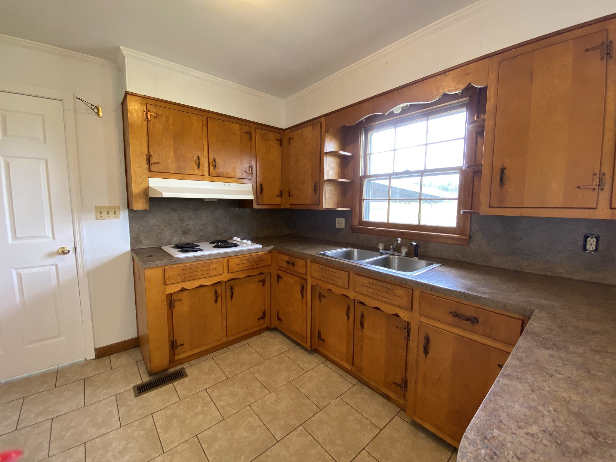 401 Whaley Street Smithville, TN 37166 - Photo 14 of 38 a kitchen with sink cabinets and window
