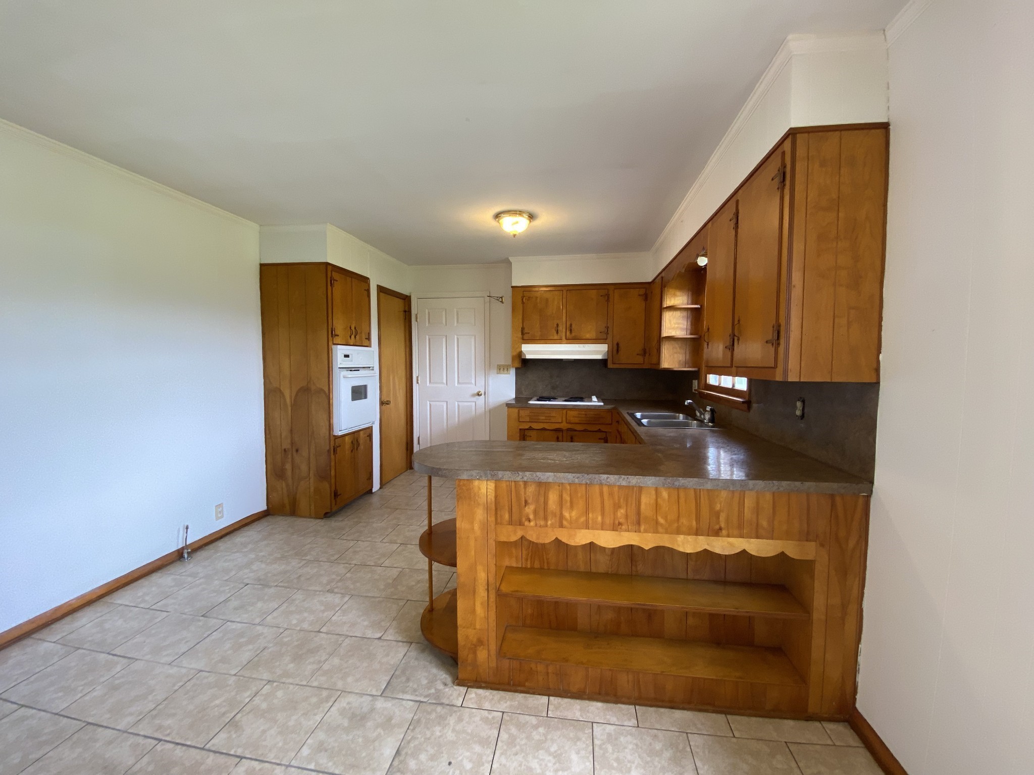401 Whaley Street Smithville, TN 37166 - Photo 15 of 38 a view of a kitchen with a sink and cabinets