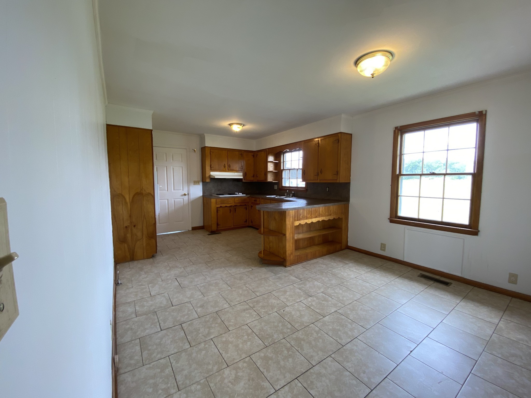 401 Whaley Street Smithville, TN 37166 - Photo 17 of 38 a view of a kitchen with furniture and windows