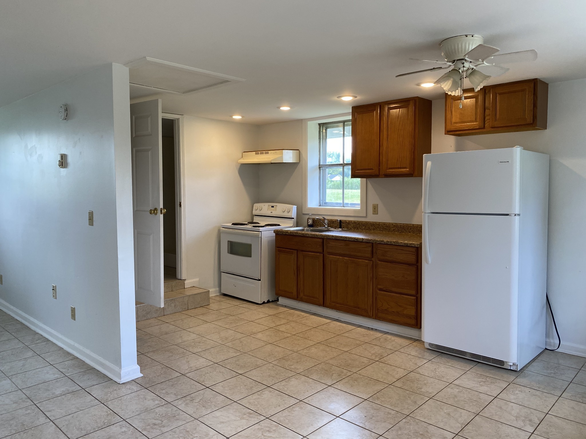 401 Whaley Street Smithville, TN 37166 - Photo 22 of 38 a kitchen with a sink a refrigerator and a stove