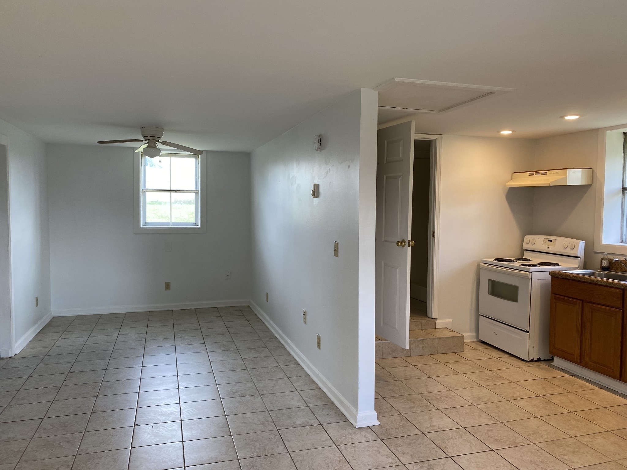 401 Whaley Street Smithville, TN 37166 - Photo 23 of 38 a view of a kitchen with dishwasher and white cabinets