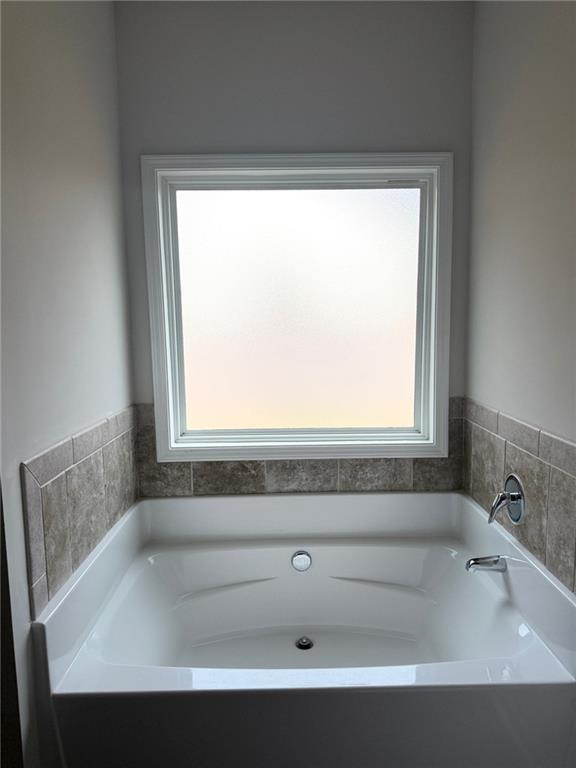 358 Mulberry Road Winder, GA 30680 - Photo 11 of 21 a bathroom with a bathtub