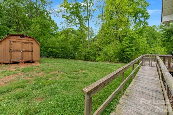 a view of a backyard with potted plants