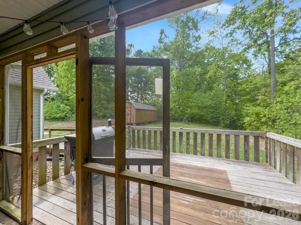 a view of balcony with wooden floor