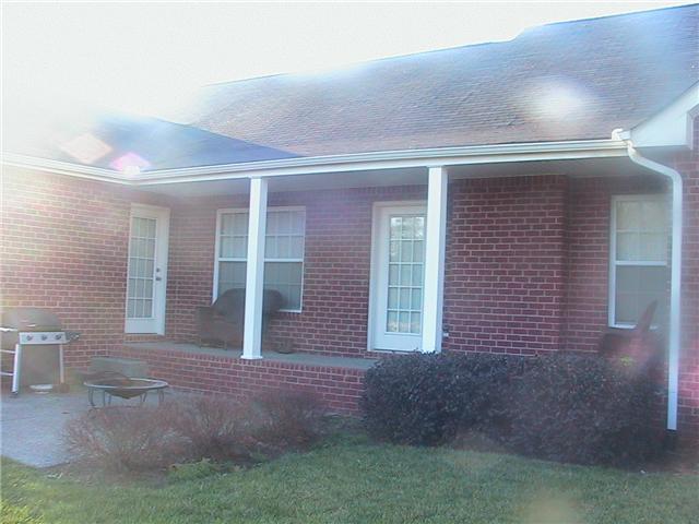 627 Briarhill Road Lebanon, TN 37087 - Photo 13 of 15 Covered porch - door from Den and Owner's Suite