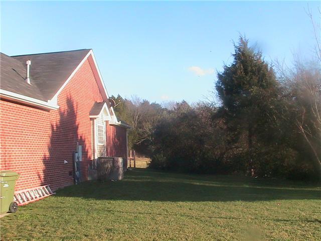 627 Briarhill Road Lebanon, TN 37087 - Photo 14 of 15 Home is all brick and surrounded by open land.