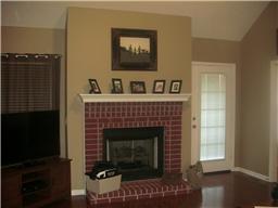 627 Briarhill Road Lebanon, TN 37087 - Photo 6 of 15 Gas fireplace in Den - Beautiful flooring throughout.