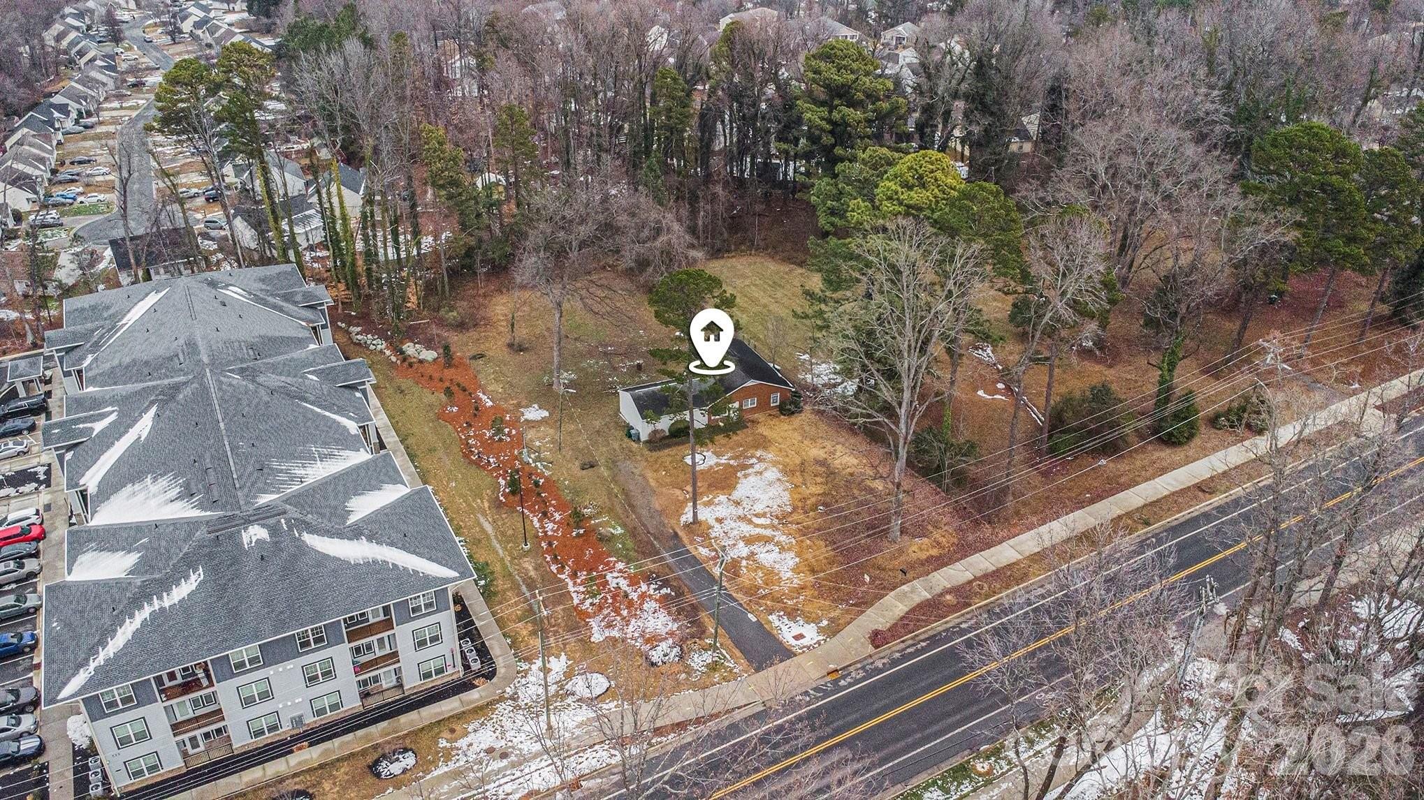 500 Tom Hunter Road Charlotte, NC 28213 - Photo 17 of 24 a backyard of a house with lots of green space