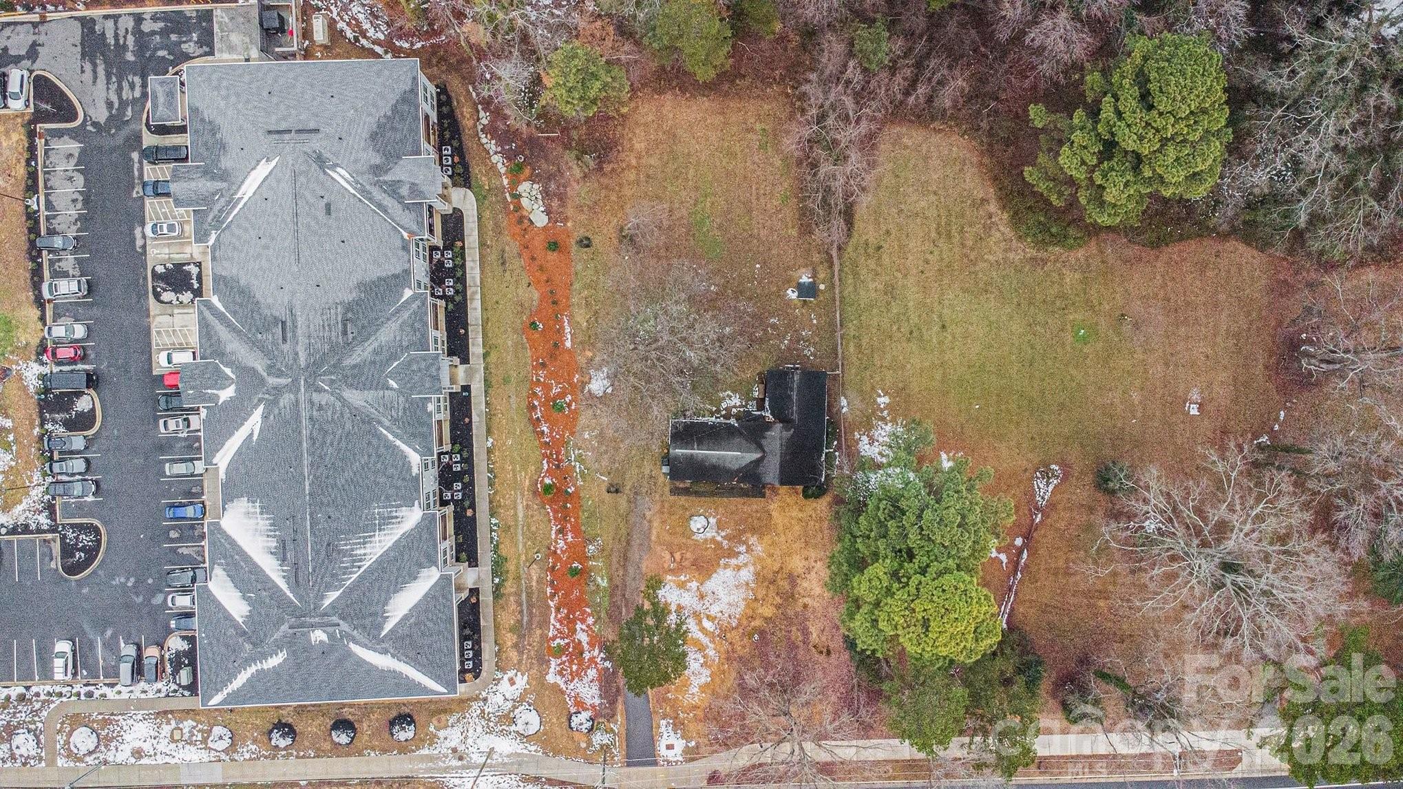 500 Tom Hunter Road Charlotte, NC 28213 - Photo 8 of 24 a aerial view of a house with a yard and large trees