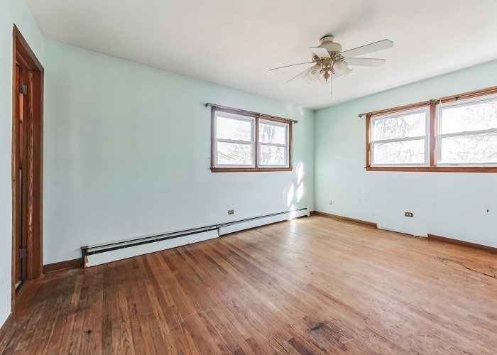 1001 Oak Lane Algonquin, IL 60102 - Photo 19 of 26 an empty room with wooden floor and windows