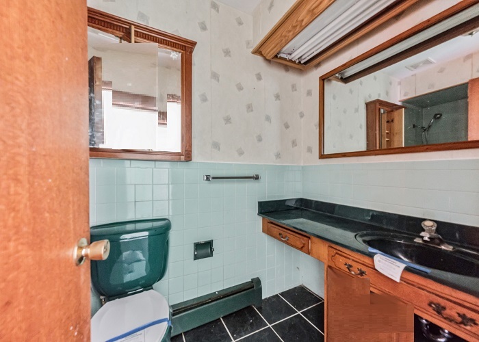 1001 Oak Lane Algonquin, IL 60102 - Photo 24 of 26 a bathroom with a toilet a sink and mirror