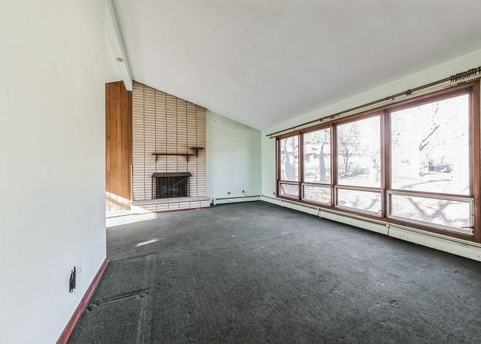 1001 Oak Lane Algonquin, IL 60102 - Photo 9 of 26 an empty room with fireplace and windows