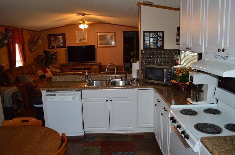 1234 Paynes Church Road Winchester, TN 37398 - Photo 11 of 27 a kitchen with a sink stove and cabinets
