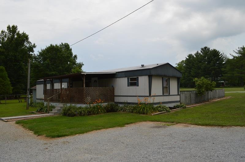 1234 Paynes Church Road Winchester, TN 37398 - Photo 2 of 27 a front view of a house with a garden