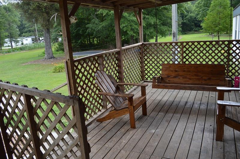 1234 Paynes Church Road Winchester, TN 37398 - Photo 5 of 27 a view of a wooden deck with wooden floor barbeque and outdoor seating