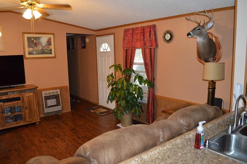 1234 Paynes Church Road Winchester, TN 37398 - Photo 6 of 27 a living room with furniture and a flat screen tv