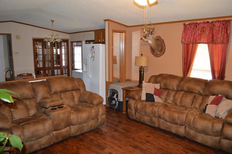 1234 Paynes Church Road Winchester, TN 37398 - Photo 8 of 27 a living room with furniture a large window and wooden floor