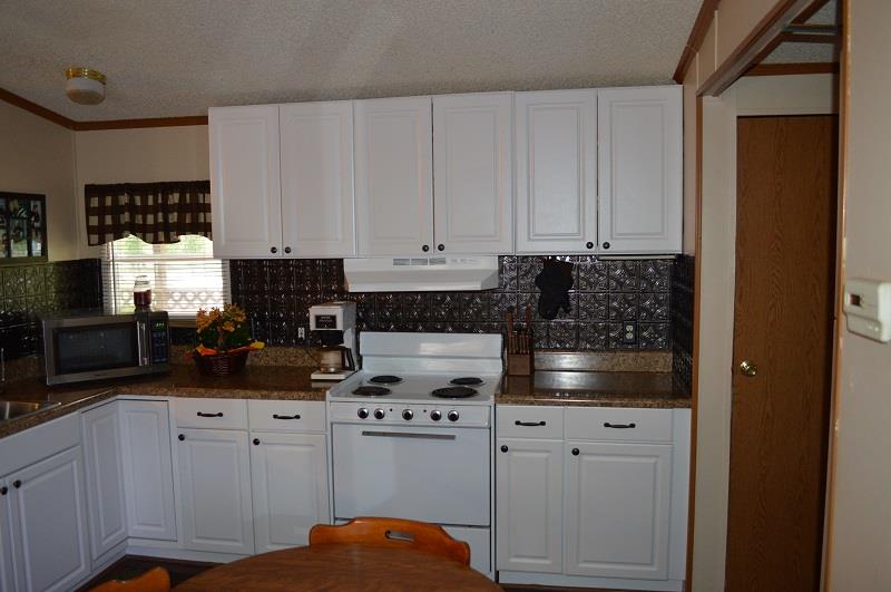 1234 Paynes Church Road Winchester, TN 37398 - Photo 10 of 27 a kitchen with appliances a sink and cabinets