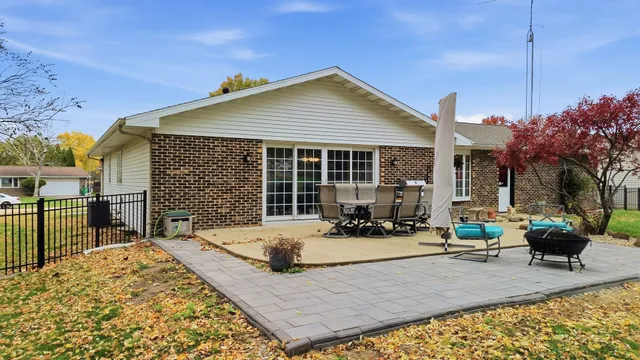 a view of a house with backyard porch and sitting area