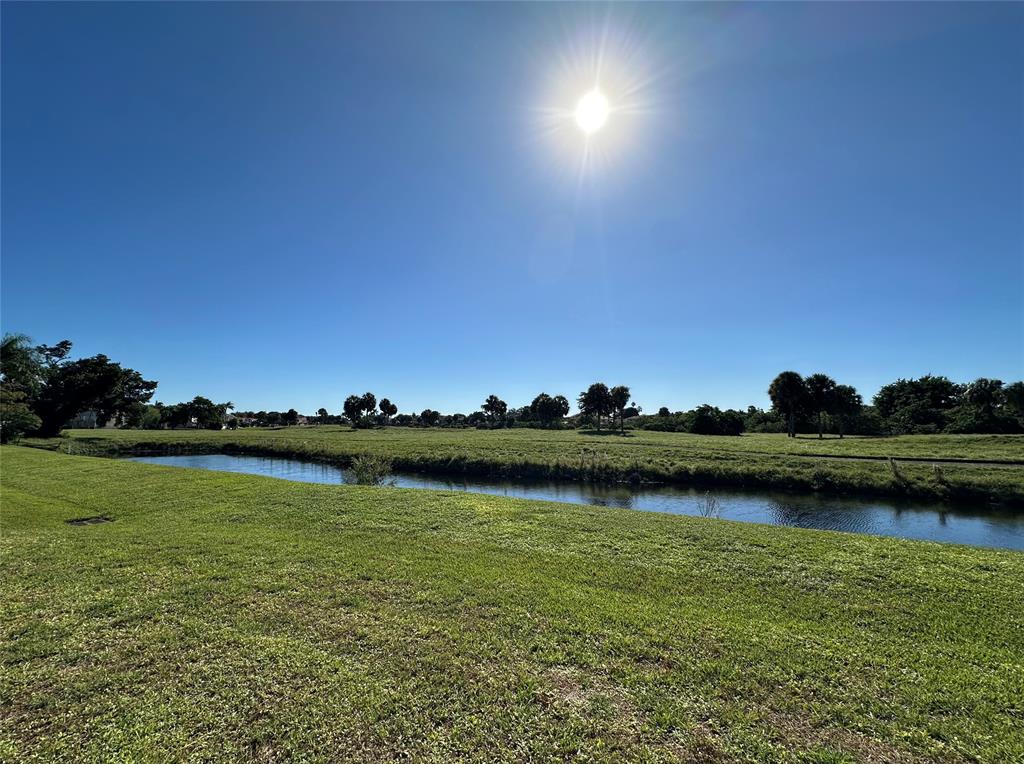 3001 Holiday Springs Boulevard, Unit 102 Margate, FL 33063 - Photo 7 of 18 an aerial view of a house with a lake view