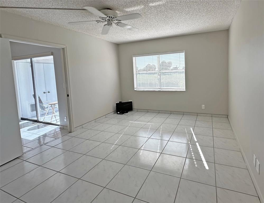 3001 Holiday Springs Boulevard, Unit 102 Margate, FL 33063 - Photo 8 of 18 a view of an empty room and window