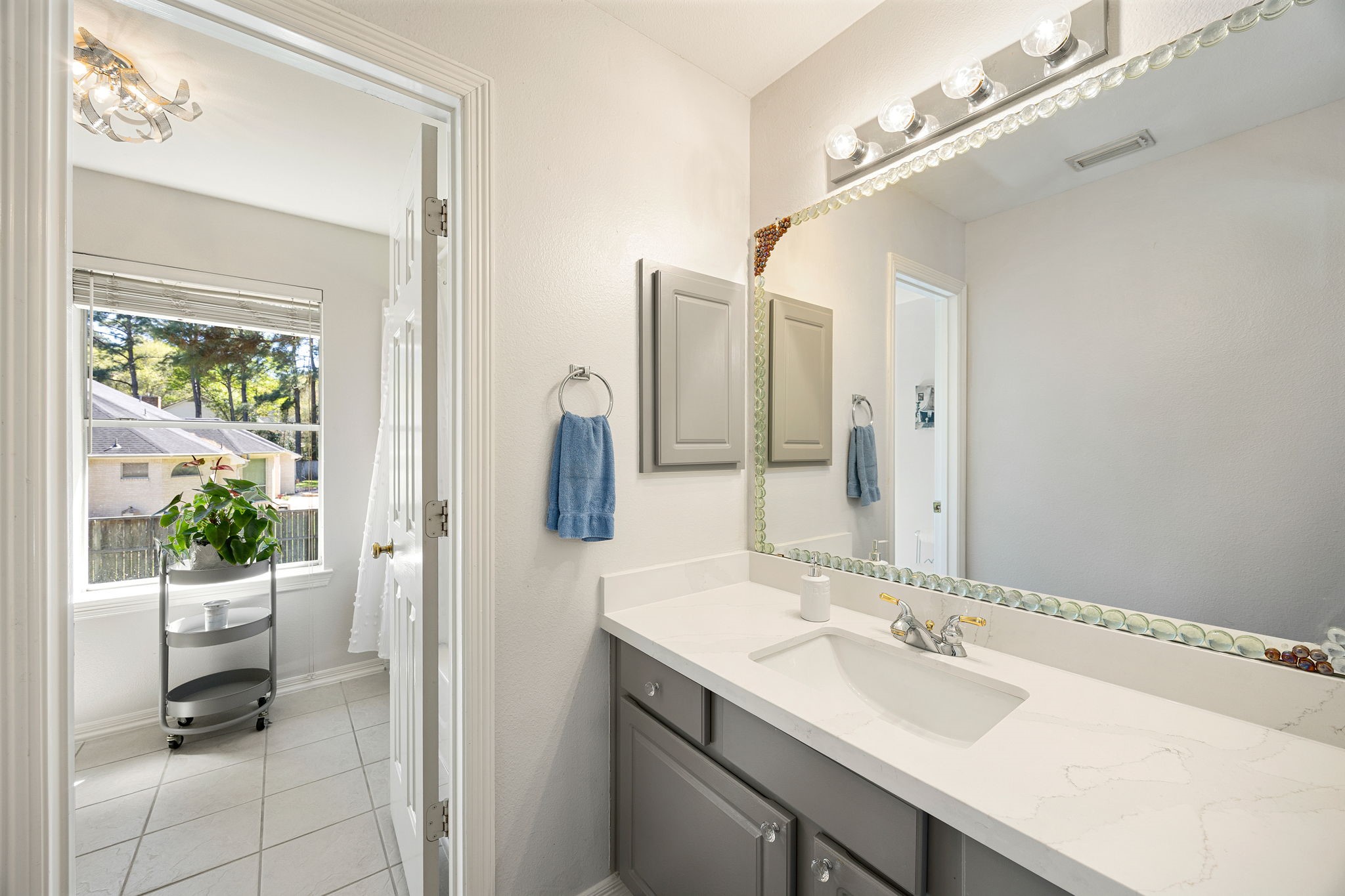 14419 Timbergreen Drive Magnolia, TX 77355 - Photo 25 of 43 Clean and functional bathroom with vanity and mirror, ideal for family or guests.