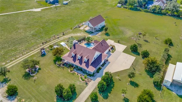 an aerial view of a house with a garden