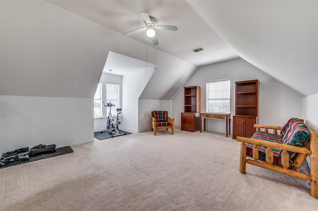 7889 County Road 134 Celina, TX 75009 - Photo 13 of 36 a view of a livingroom with toys and a ceiling fan
