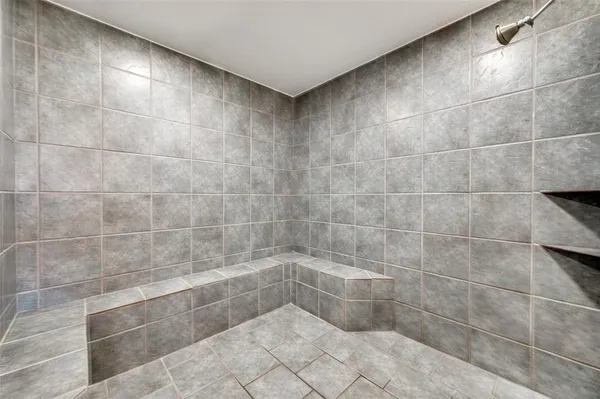 a bathroom with a bathtub and a sink