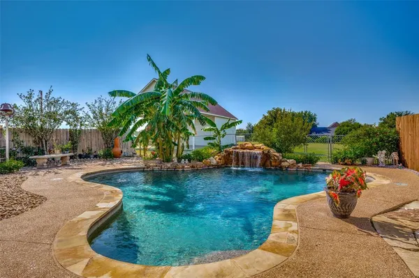 a view of a swimming pool with lounge chair