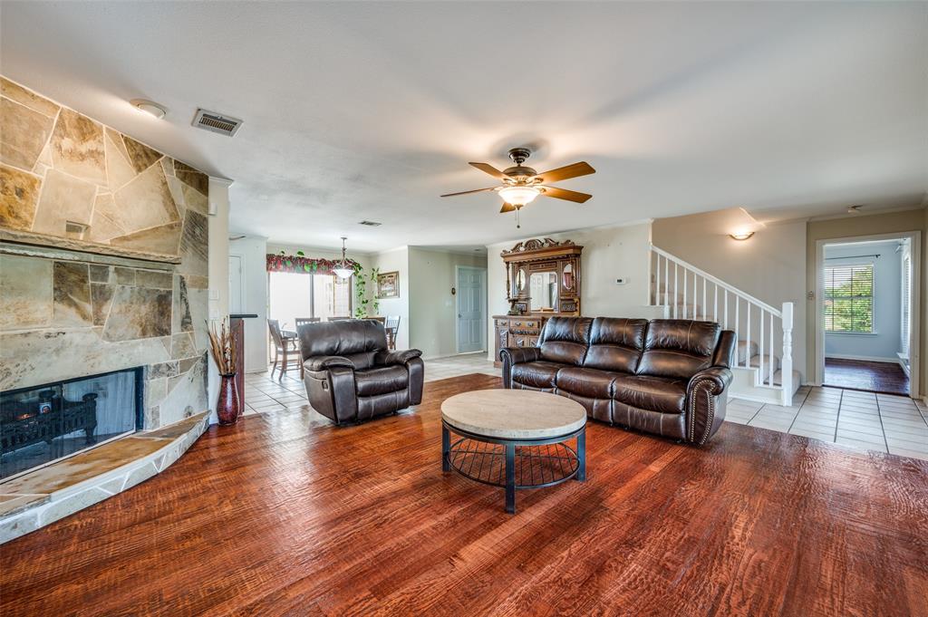 7889 County Road 134 Celina, TX 75009 - Photo 31 of 36 a living room with furniture and a fireplace