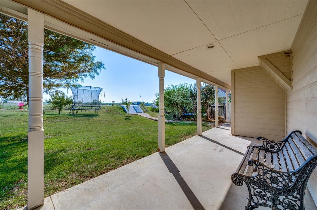 7889 County Road 134 Celina, TX 75009 - Photo 35 of 36 a view of backyard with green space and balcony
