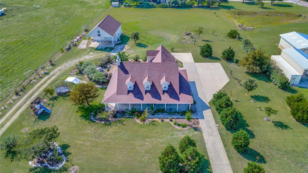 7889 County Road 134 Celina, TX 75009 - Photo 7 of 36 an aerial view of a houses with outdoor space swimming pool and ocean view