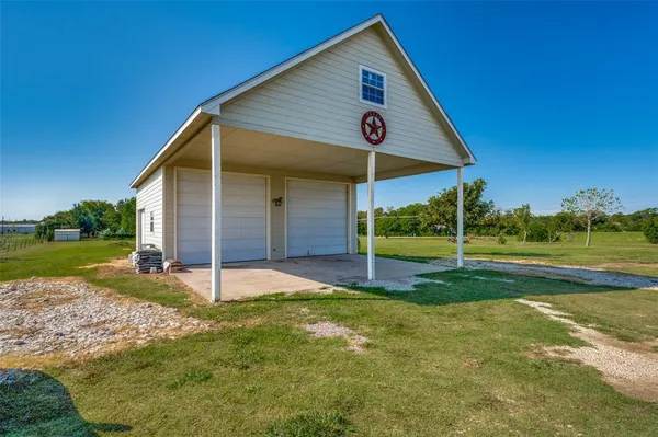 a front view of house with yard and seating space