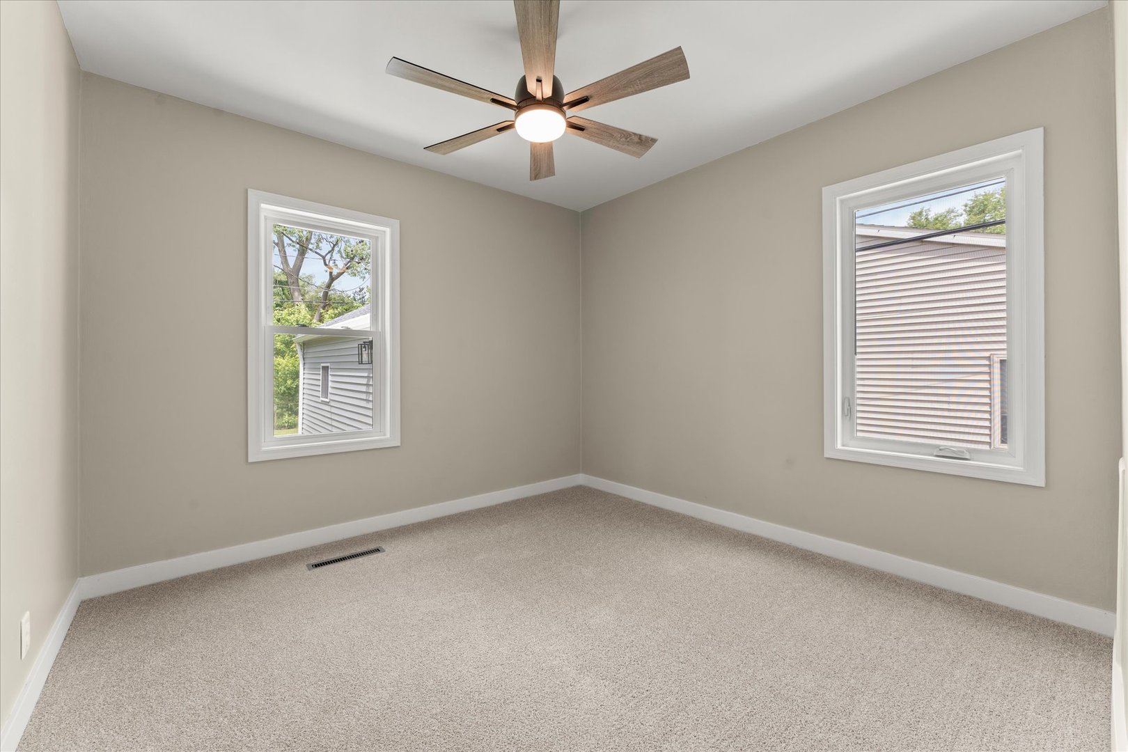 305 South Fair Street Champaign, IL 61821 - Photo 19 of 41 an empty room with windows and fan