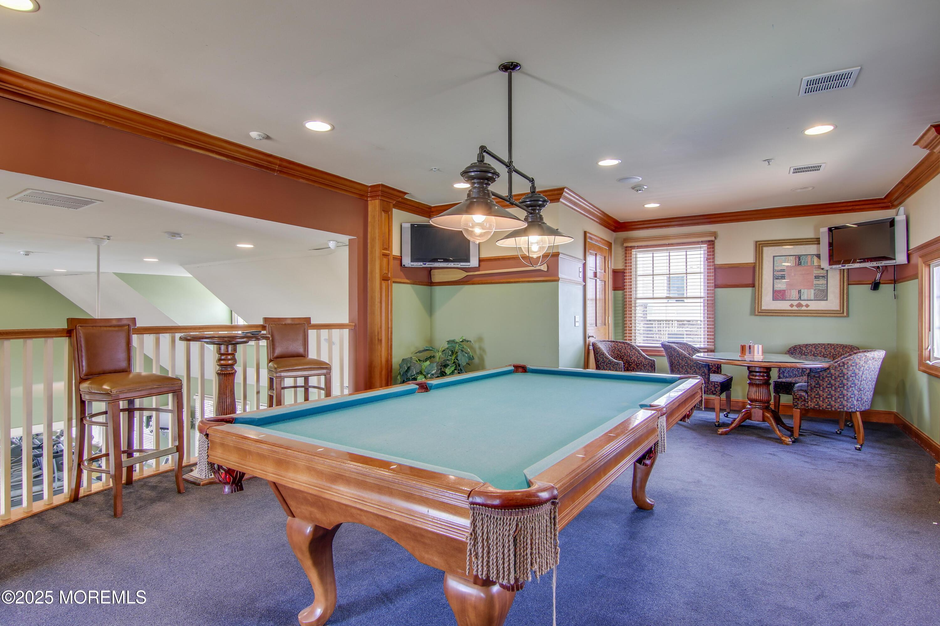 33 Cooper Avenue, Unit 210 Long Branch, NJ 07740 - Photo 7 of 12 a room with furniture pool table wooden floor and windows