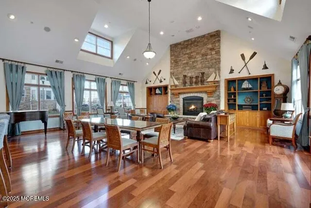 a living room with fireplace furniture and a wooden floor