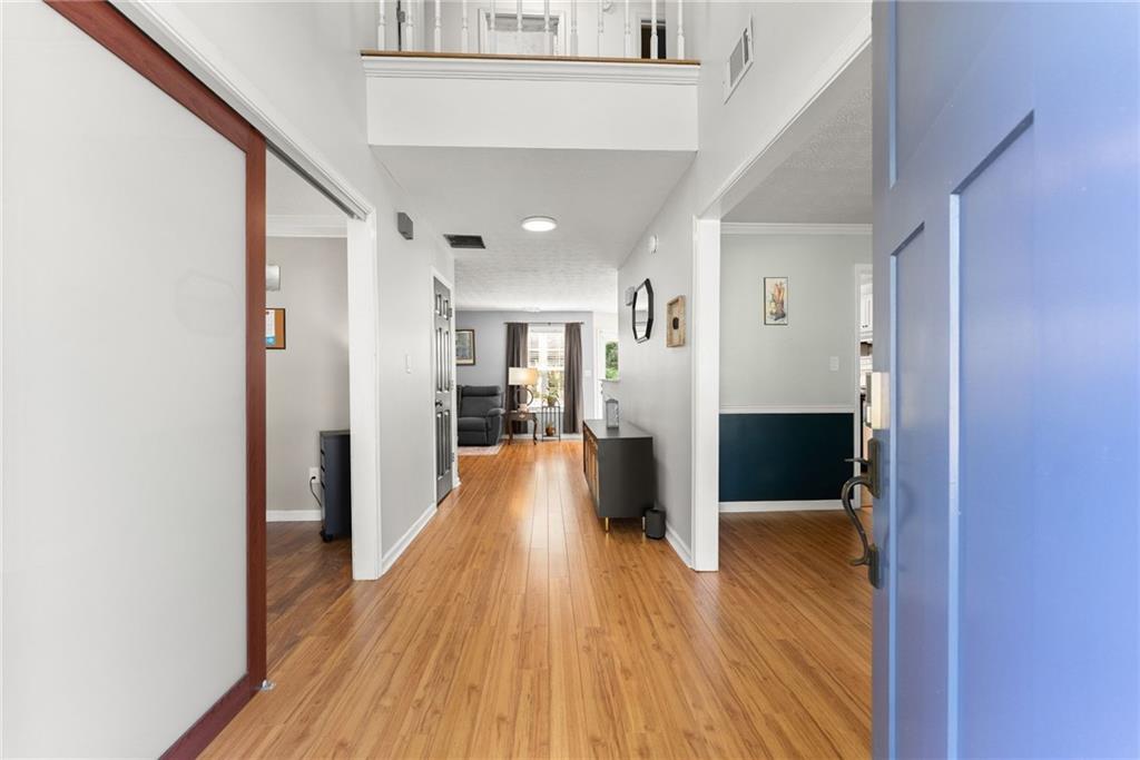 4055 Ivy Run Circle Duluth, GA 30096 - Photo 11 of 55 a view of a hallway with wooden floor and furniture